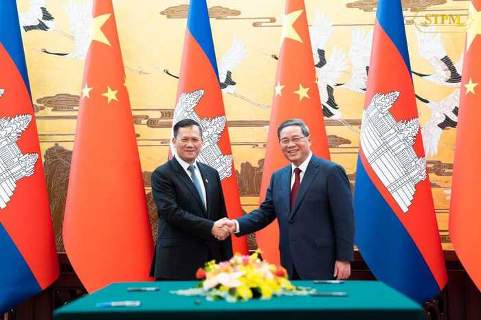 李强同柬埔寨首相洪玛耐会谈，两国签署多项双边合作文件